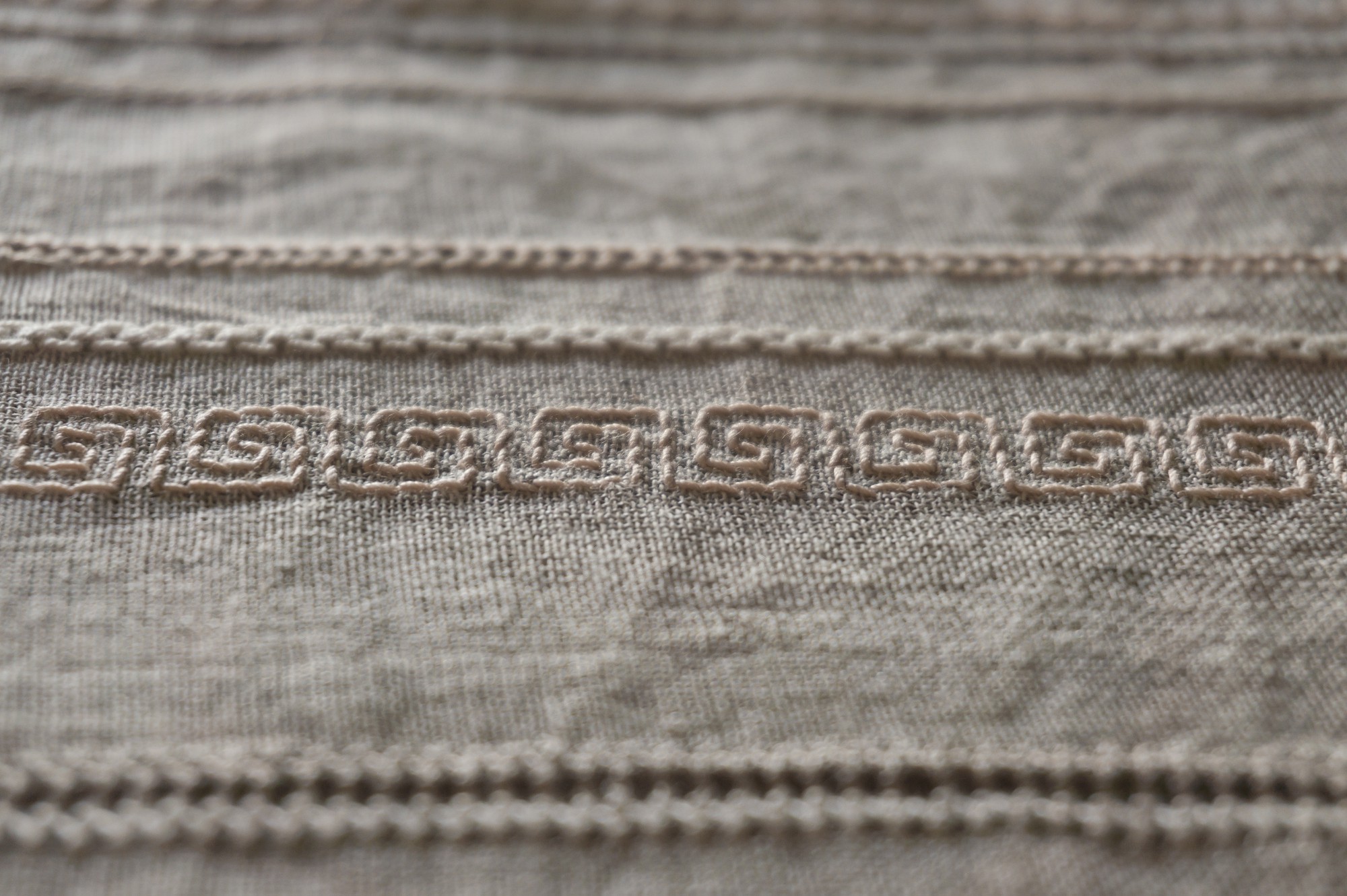 Large embroidered linen sample with subtle tones