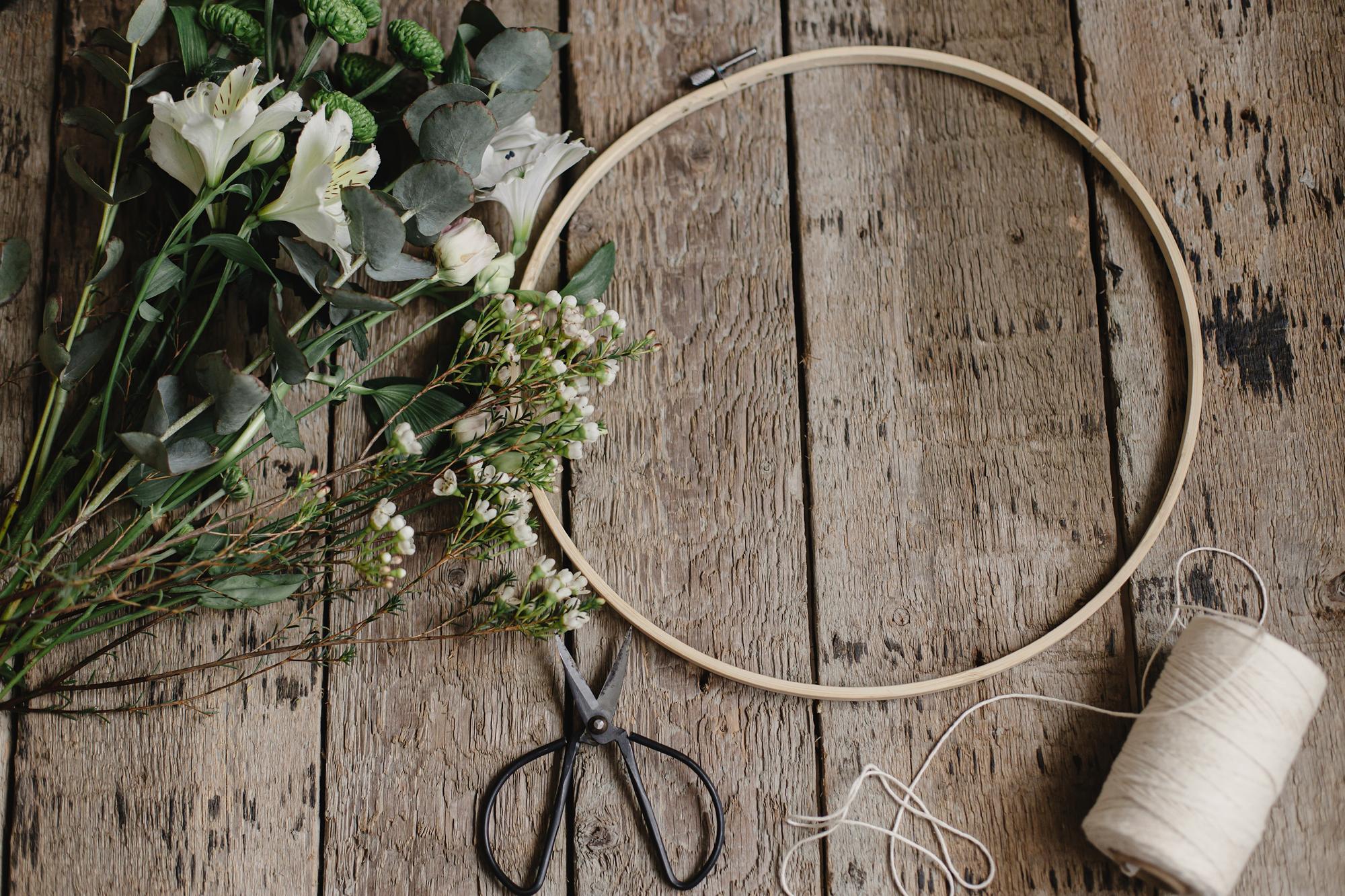 Soft monochrome embroidery hoop on a neutral table